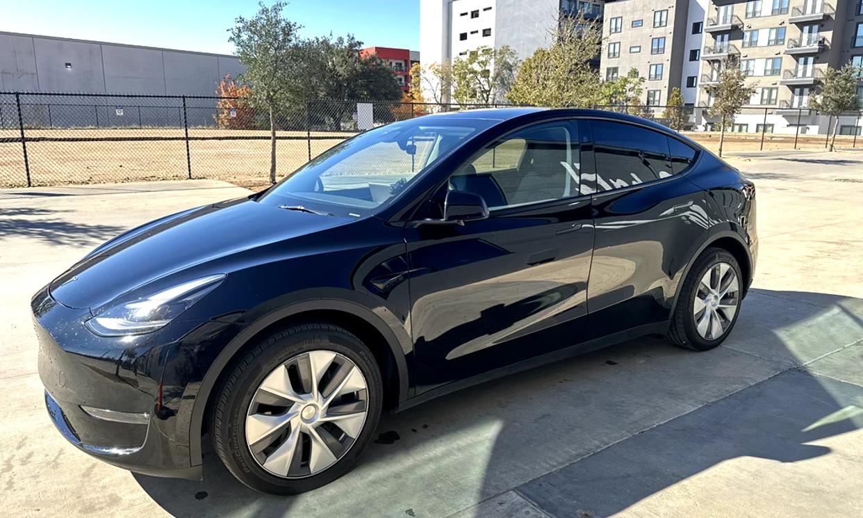 Tesla Model Y 2023 in black color parked outdoors