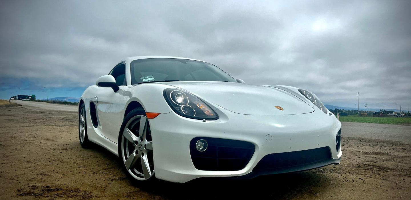 Porshe Cayman White with Black interior